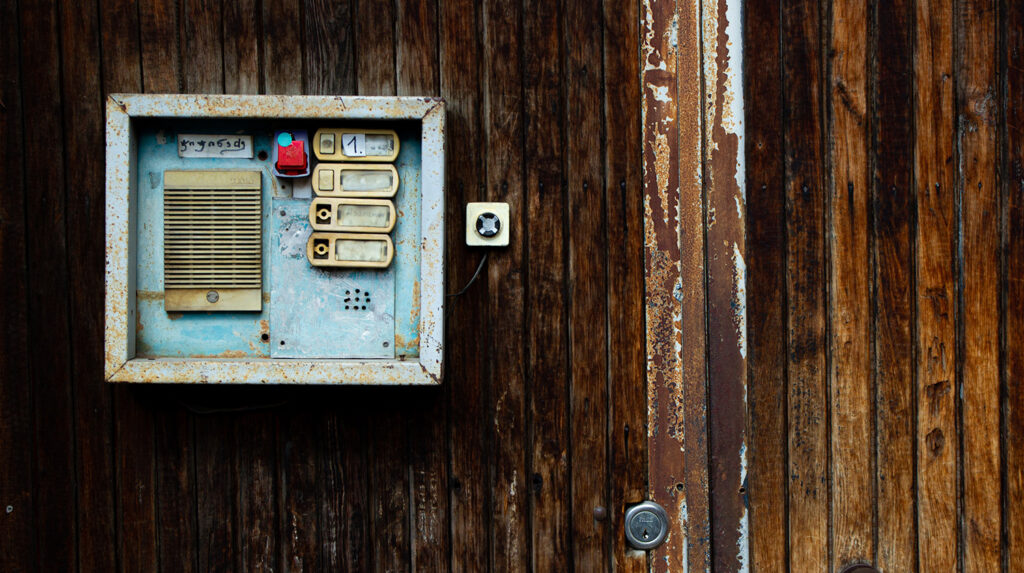 old and outdated access system mounted on wood wall