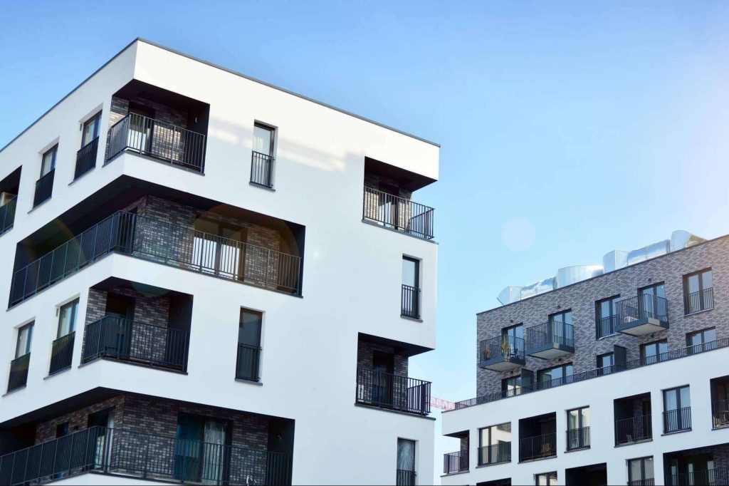 white and brick apartment buildings