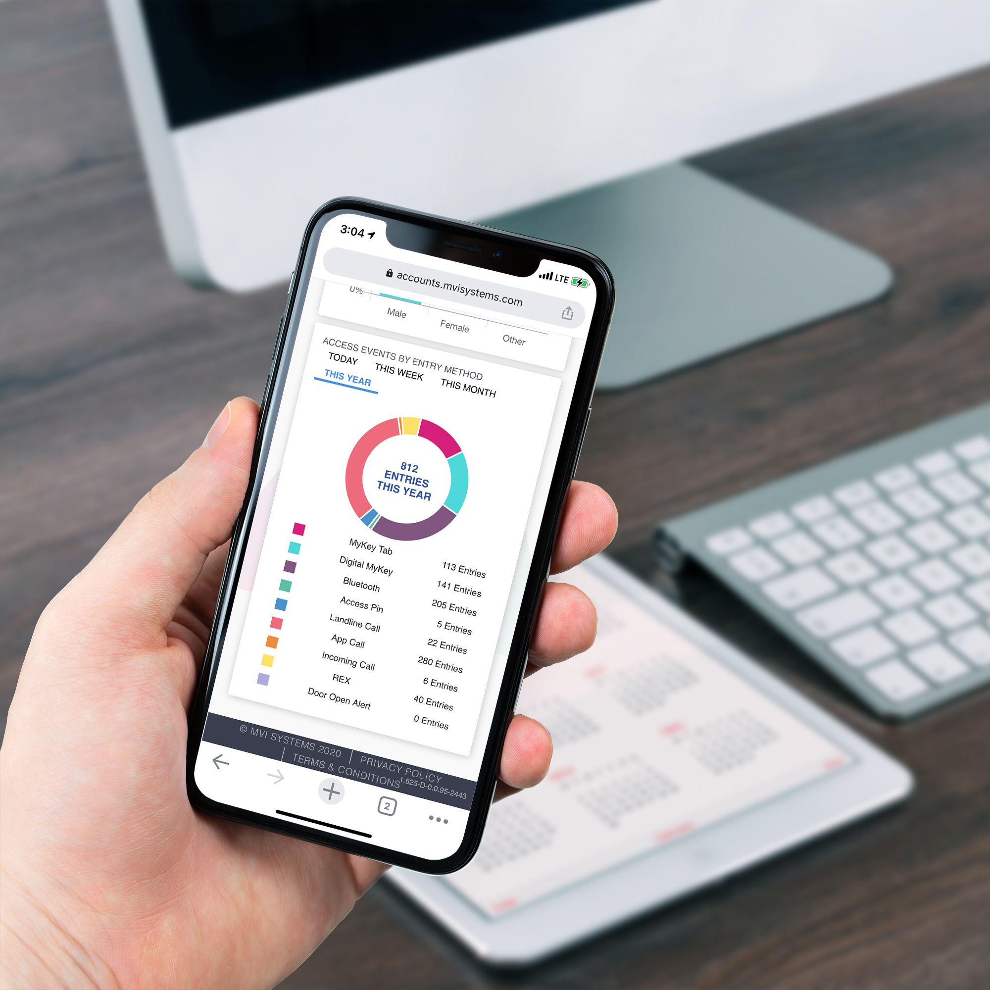 person holding cell phone and accessing their mvi account