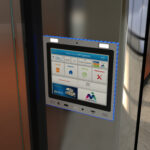 mvi keycom system mounted on metal wall by elevator