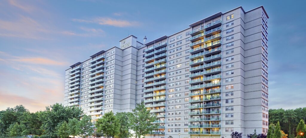 exterior of grand apartment complex in evening