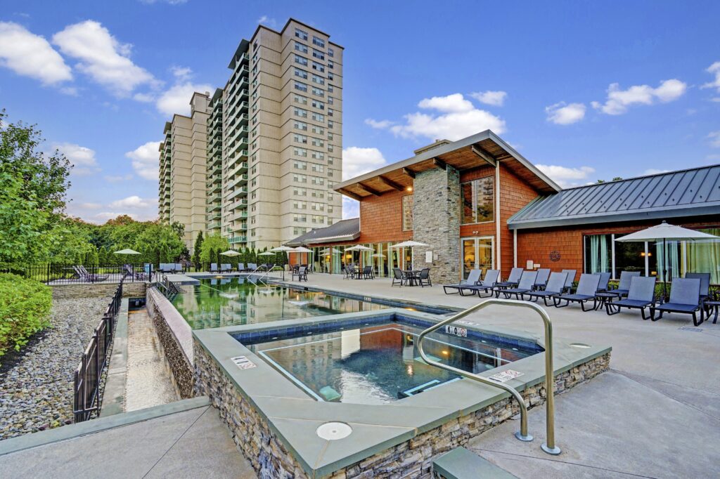 exterior of the grand apartment complex and pool