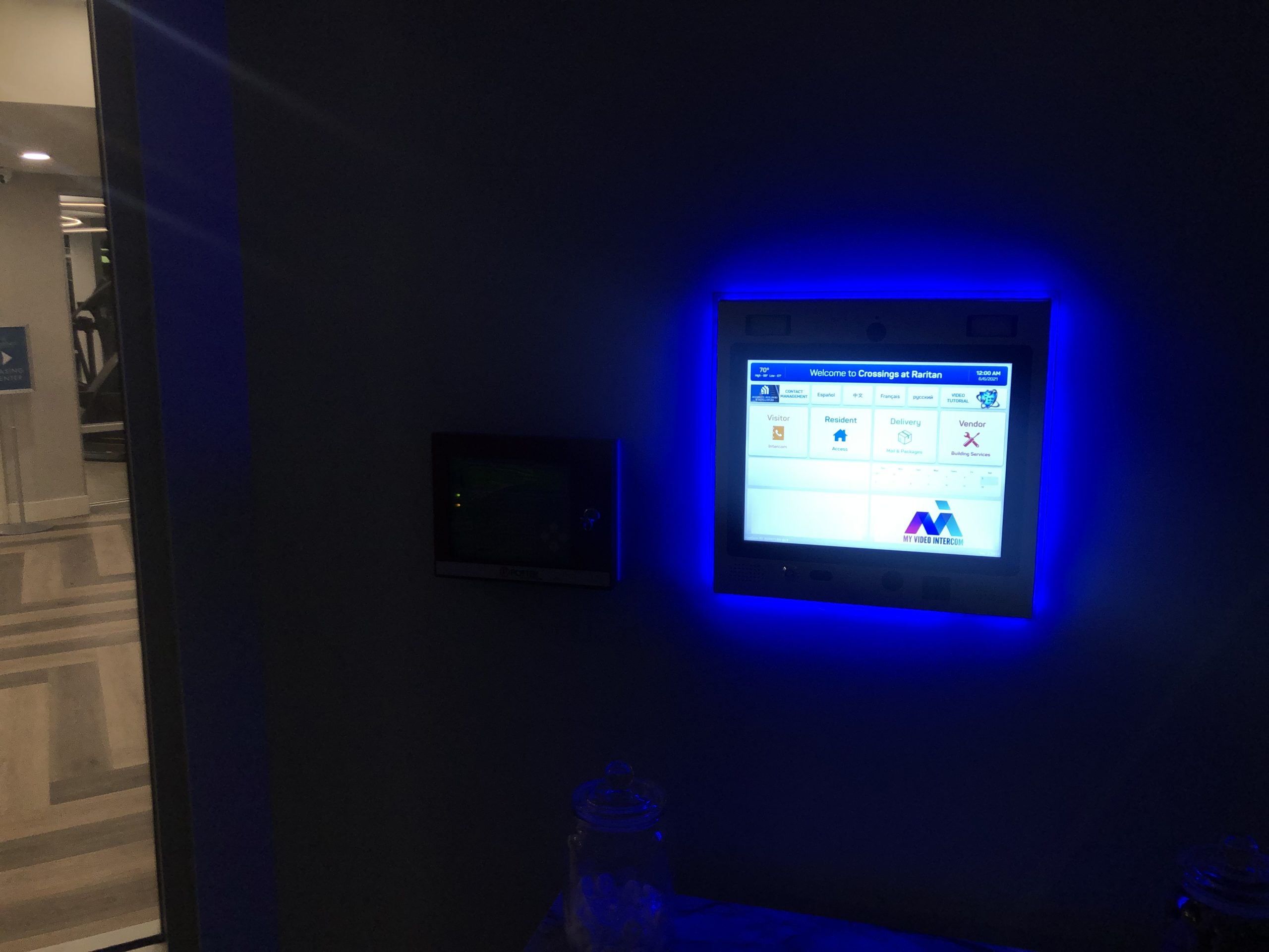 mvi keycom mounted on wall being illuminated by blue light