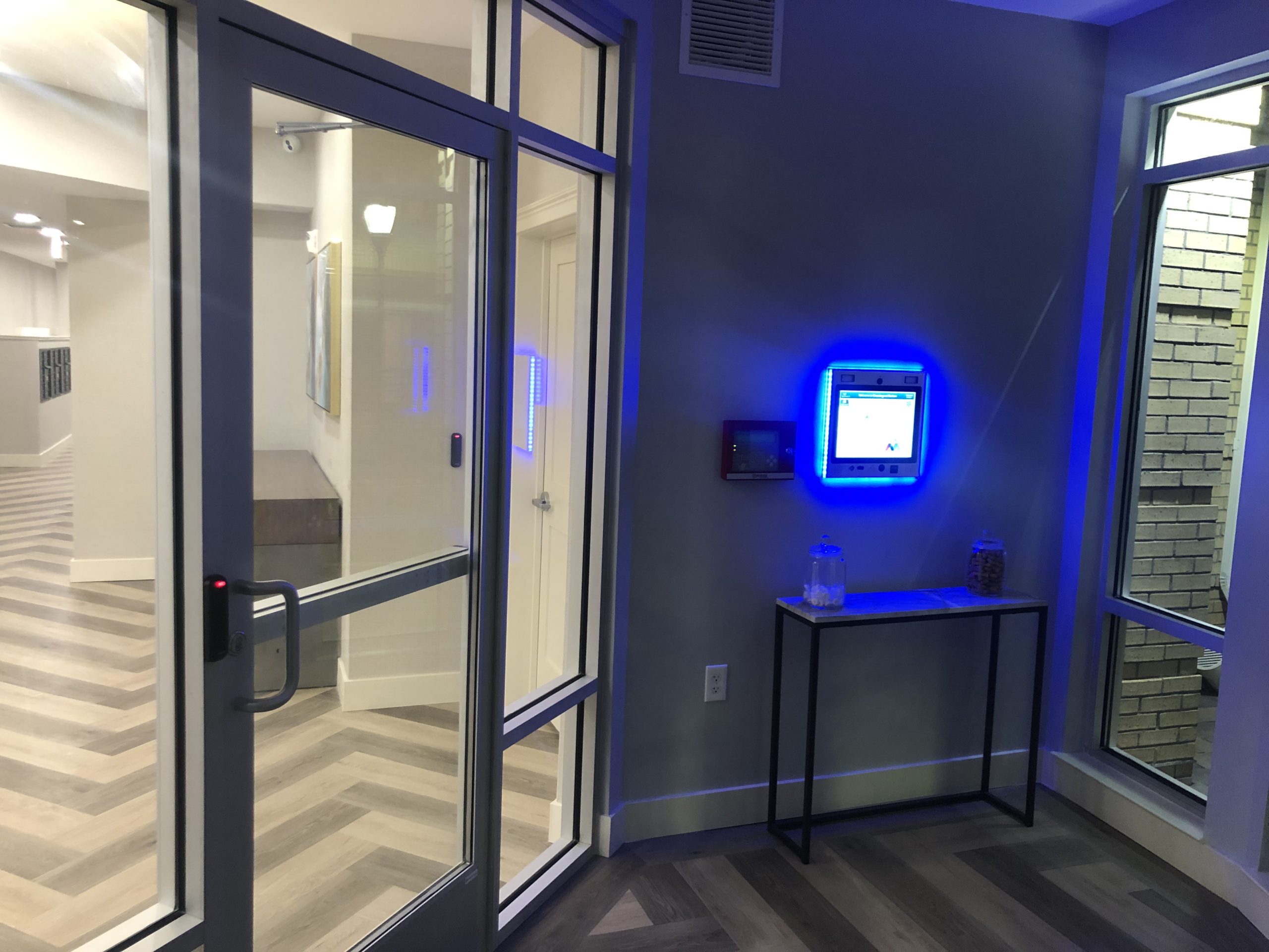 mvi keycom mounted on wall by entrance to apartment building