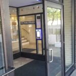 mvi keycom mounted on wall by office building entrance