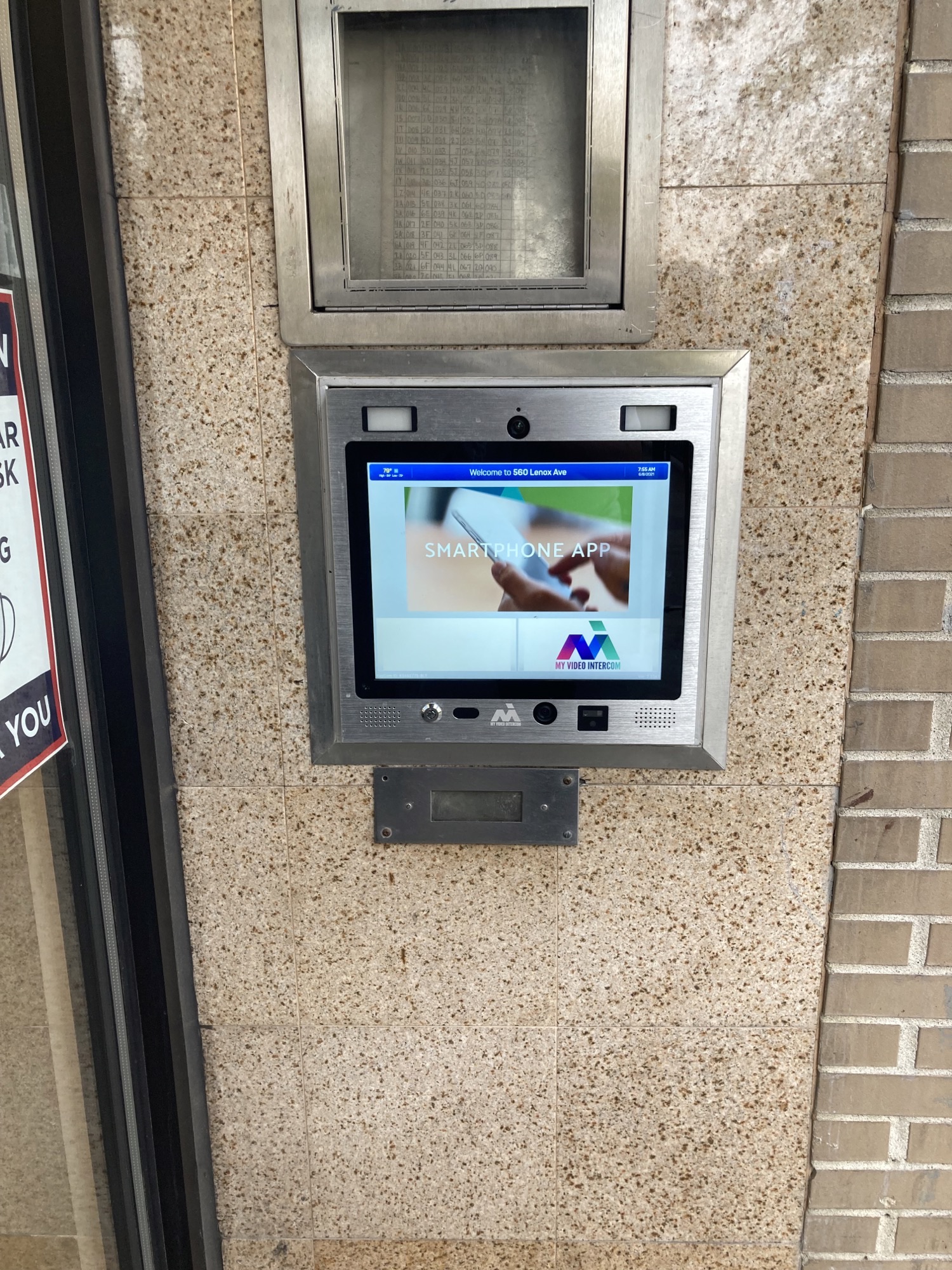 mvi keycom mounted on wall by building entrance