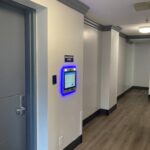 mvi keycom mounted on wall next to office entrance