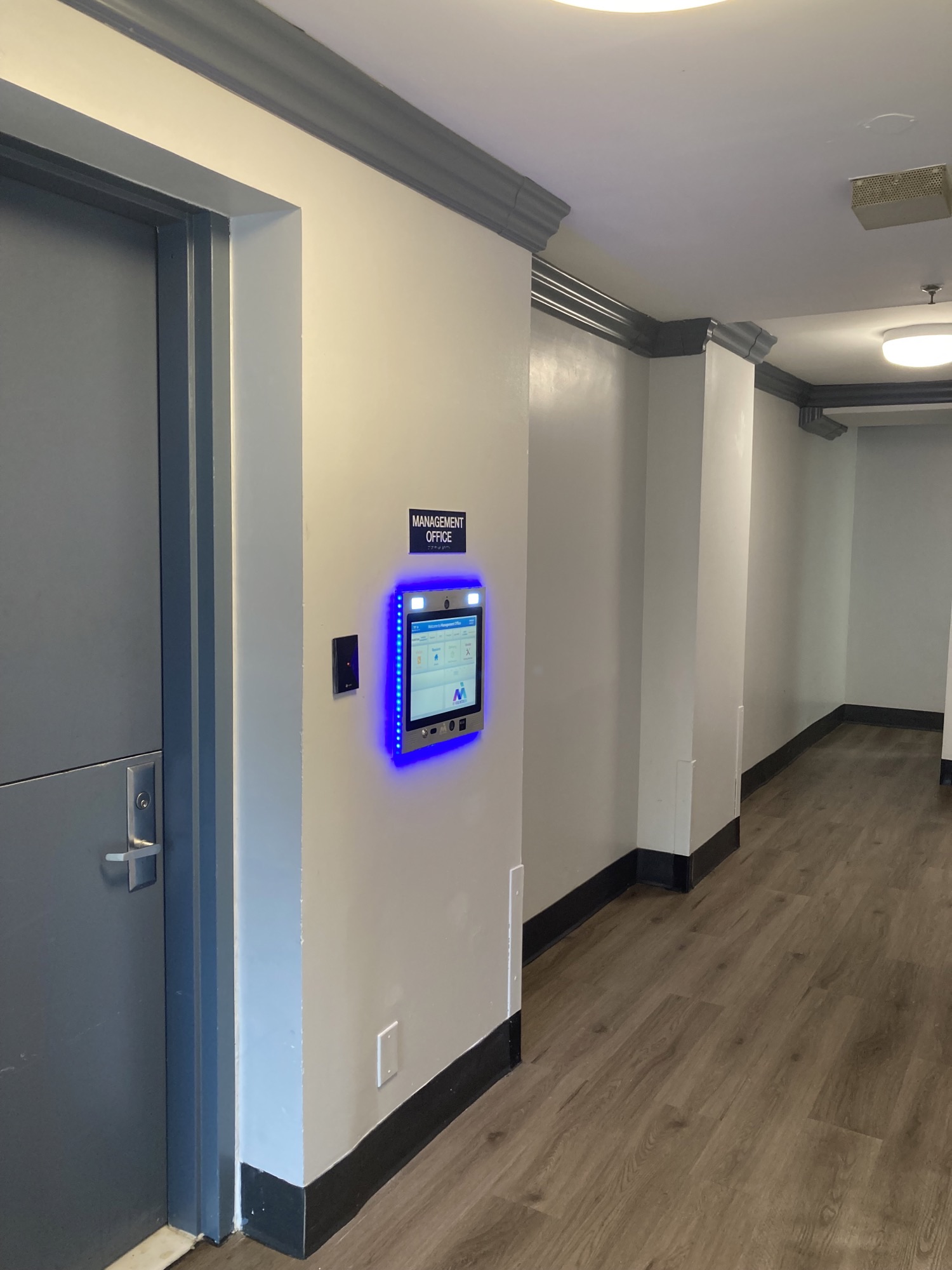 mvi keycom mounted on wall next to office entrance