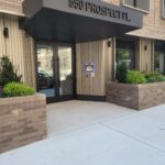 mvi keycom mounted on wall by office building entrance