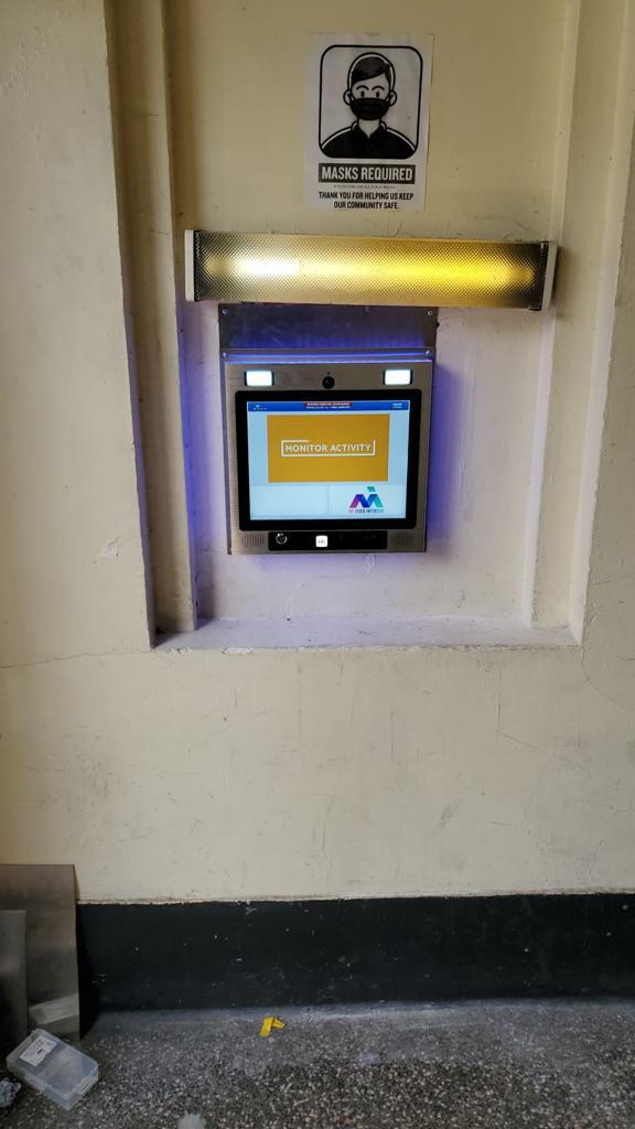 mvi keycom system mounted on wall by building entrance