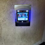 mvi keycom system mounted on wall by building entrance