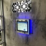 mvi keycom mounted on stone wall by building entrance