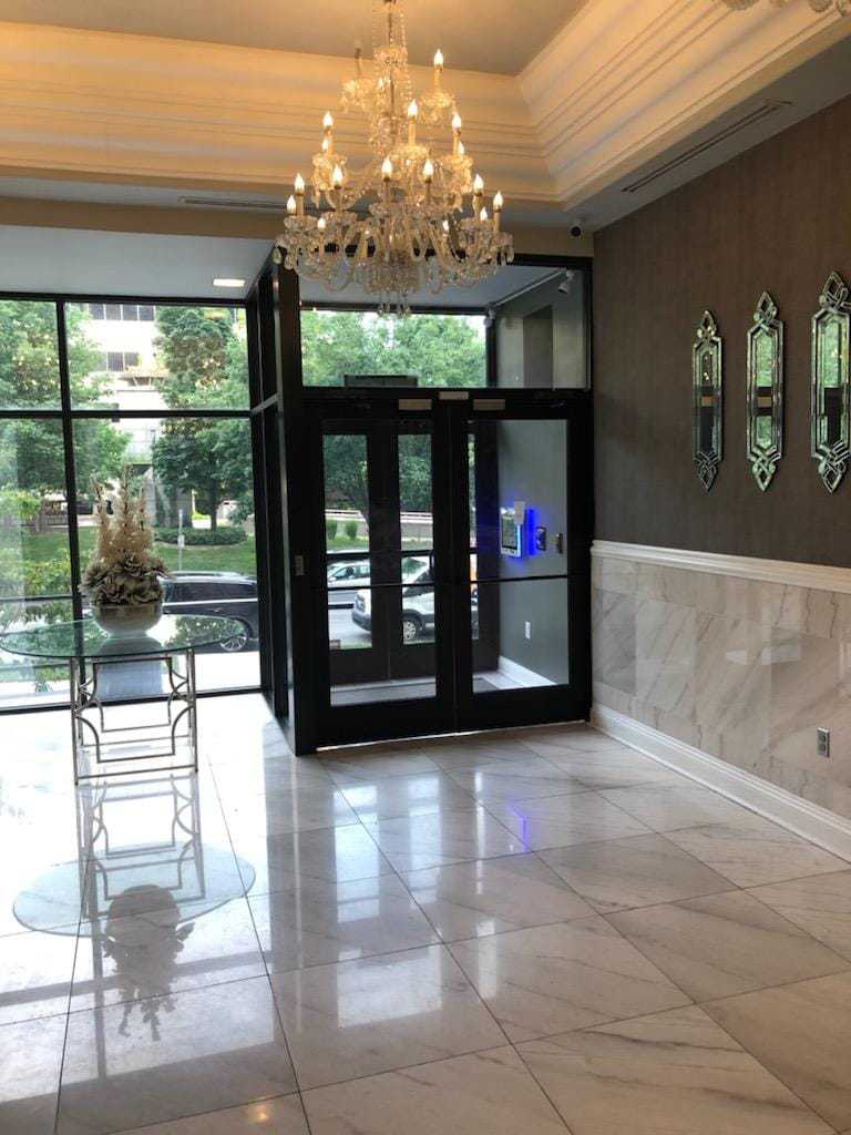 mvi keycom system mounted on wall by apartment building entrance