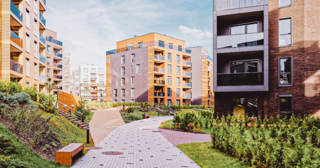 exterior of multi-family property with benches and brick walkways