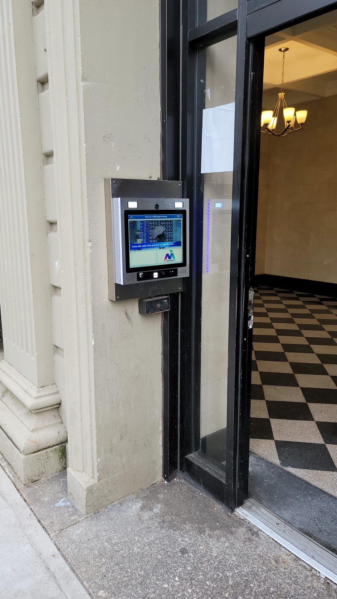 mvi video access system installed on white stone building