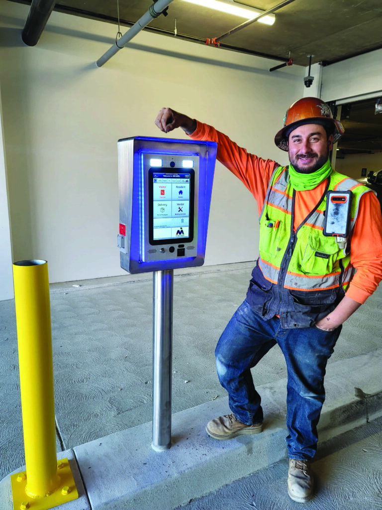 mvi installer standing next to installed mvi keycom