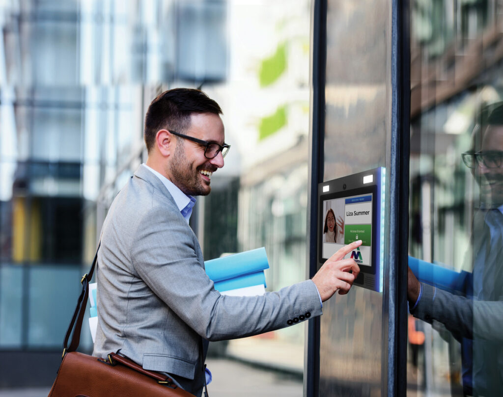 man using mvi keycom keyless door entry system